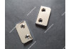 Kovanie pre upevnenie basového remeňa na telo heligónky.